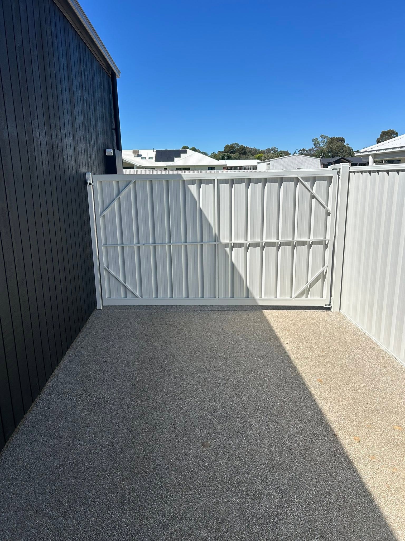 White Colorbond double gates – a real job by Anesbury Fencing & Construction in Wagga Wagga