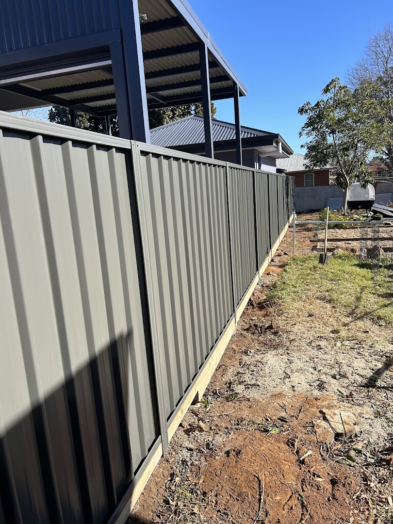 A Colorbond fence over sleeper retaining, seen from above – a real job by Anesbury Fencing & Construction in Wagga Wagga